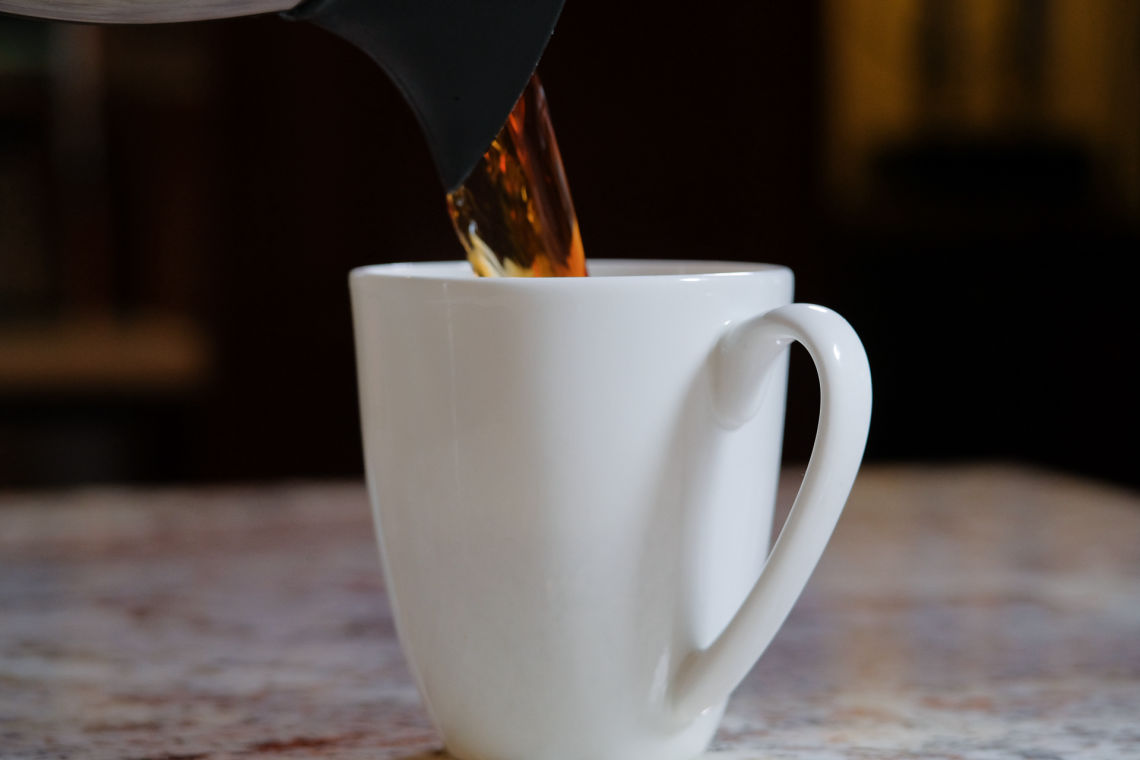 image: coffee being poured into a cup