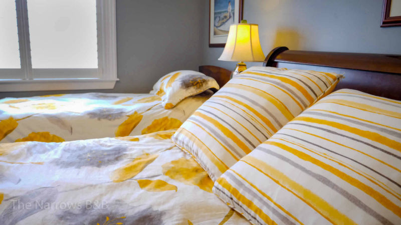 image: beds with striped pillows